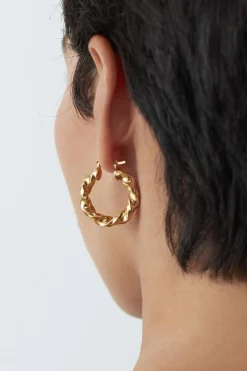 Dipua Argola Bruli em Ouro - Design Intrigante com um Toque de Modernidade