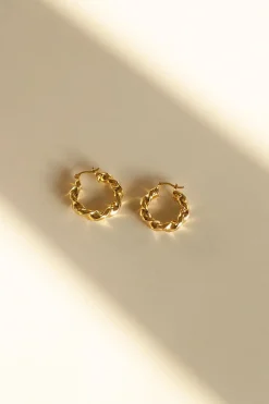 Dipua Argola Bruli em Ouro - Design Intrigante com um Toque de Modernidade